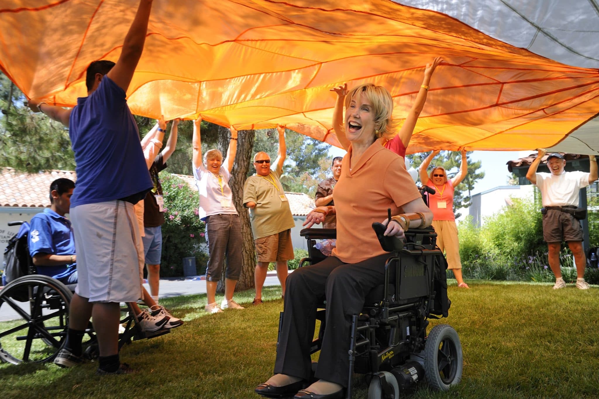 Joni at Family Retreat Joni under the orange parachute at retreat
