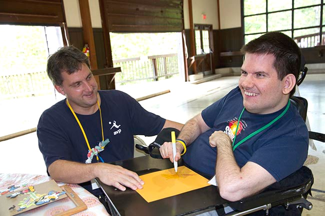 10 Things Say to a Friend With a New Disability Man helping his friend in a wheelchair