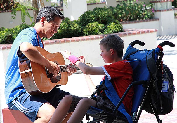 playing guitar at family retreat playing guitar at family retreat