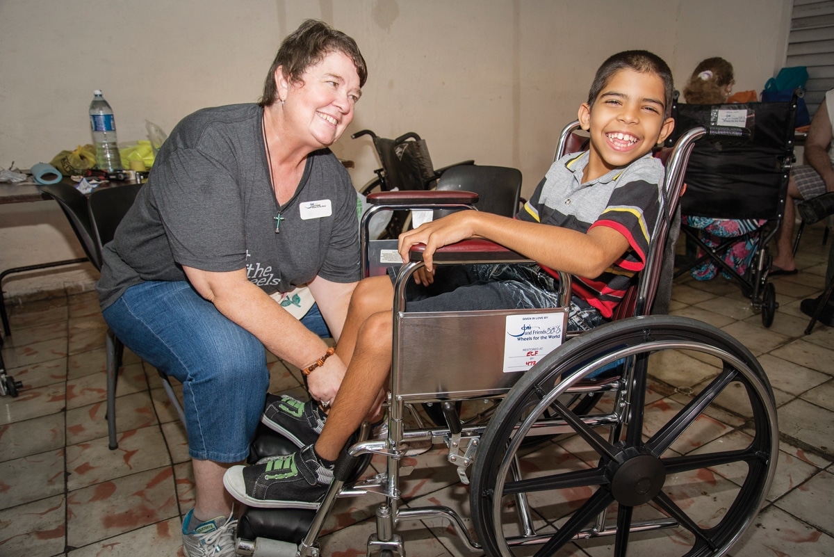 Javier receiving a wheelchair from Wheels for the World Javier receiving a wheelchair from Wheels for the World