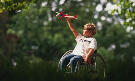You Can Do Great Things! Boy in wheelchair with toy airplane