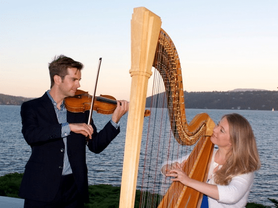 Jason playing violin and Earecka playing harp Jason playing violin and Earecka playing harp