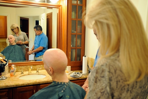 joni in front of a mirror during cancer treatment