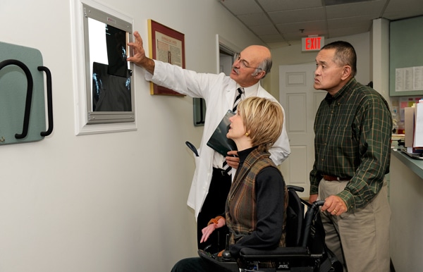 Doctor showing Joni and Ken her xray Doctor showing Joni and Ken her xray