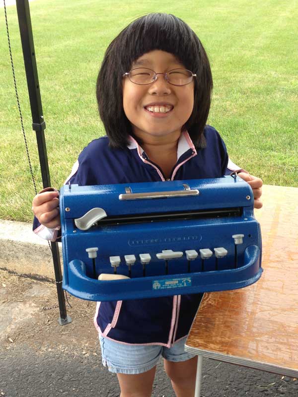 Lia with her Braille typewriter Lia with her Braille typewriter