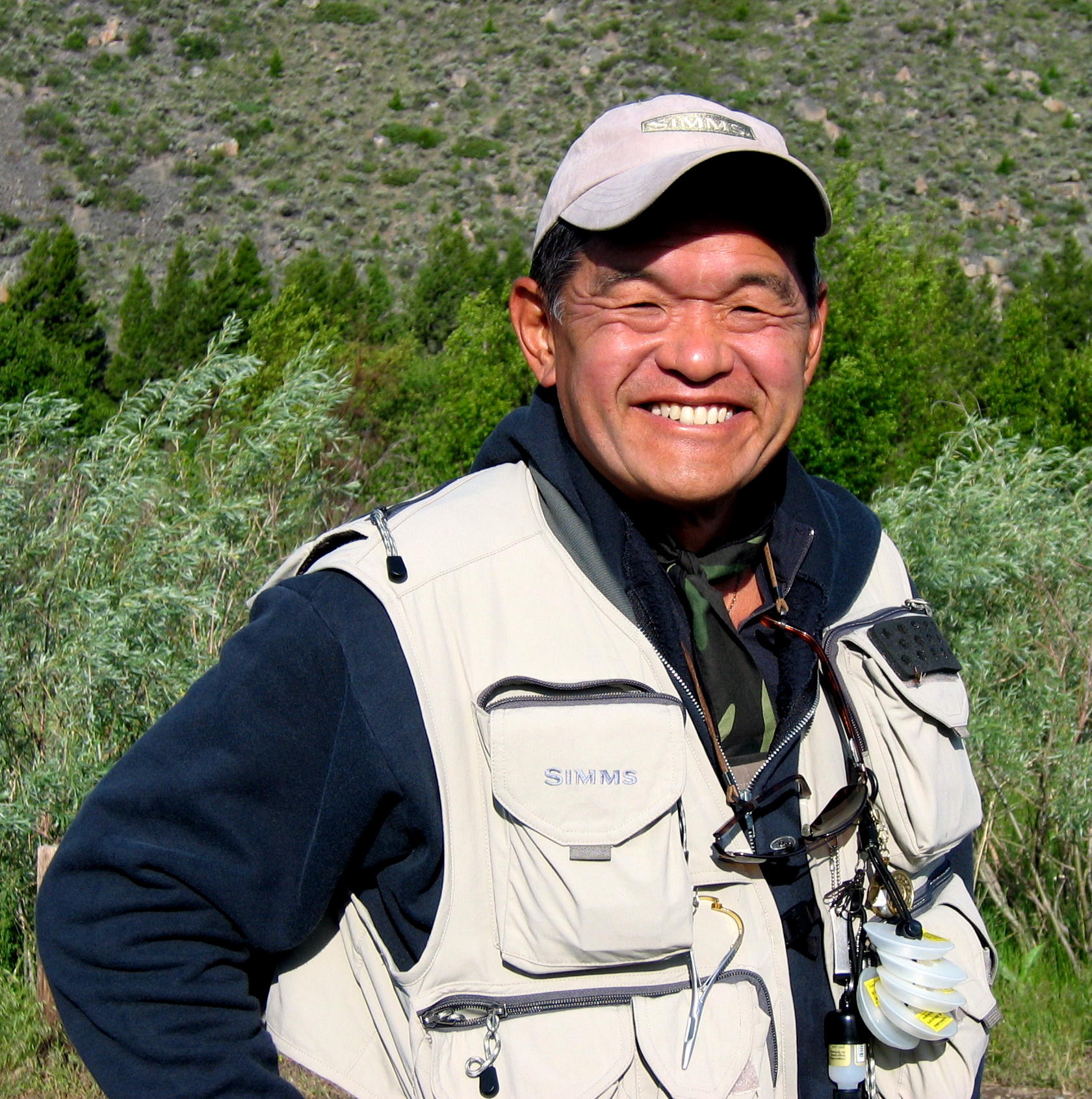 Ken Tada Ken Tada wearing a fishing vest.