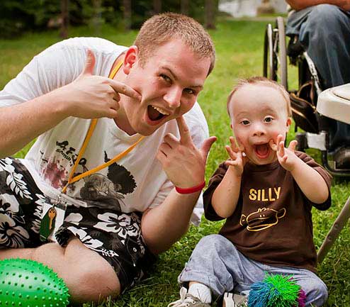 Volunteer with camper at Family Retreat