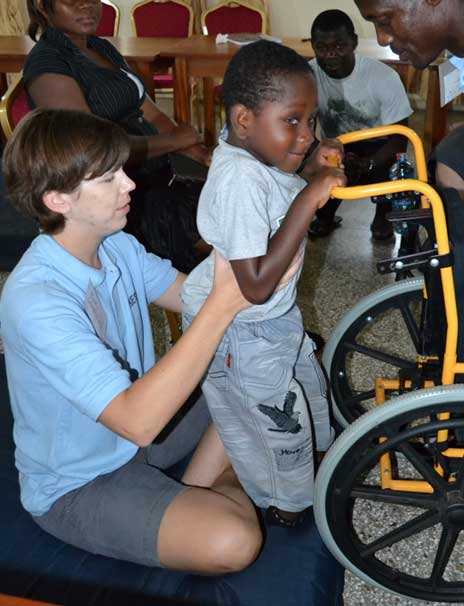 boy receiving wheelchair boy receiving wheelchair
