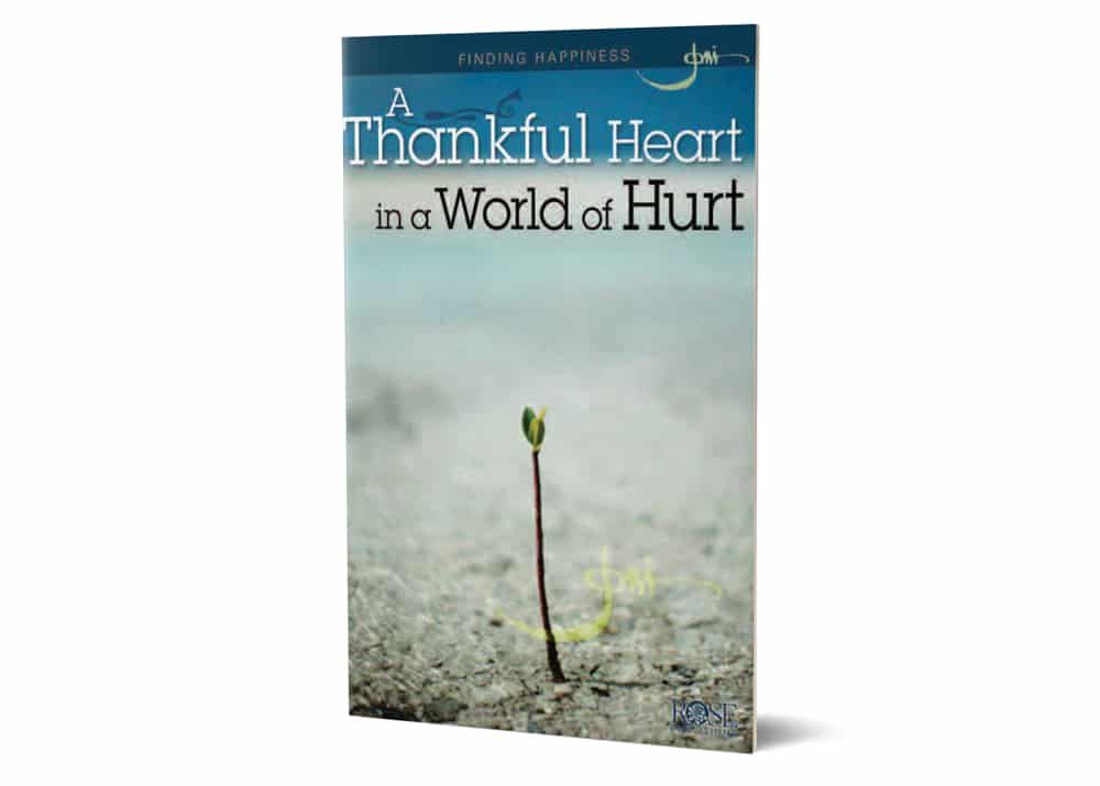A blue book cover with the title A Thankful Heart in a World of Hurt