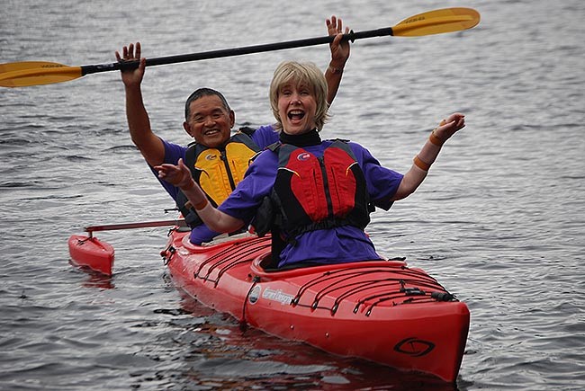 Joni and Ken smiling together in a kayak!