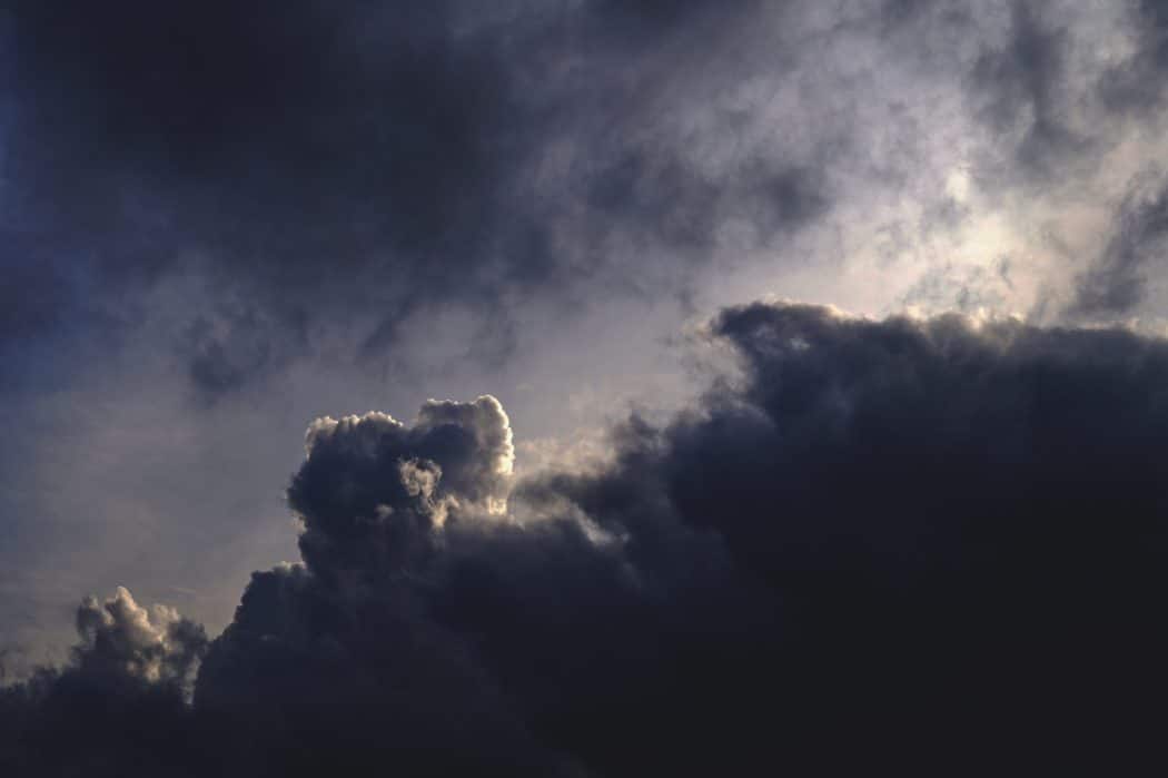 A dramatic sky filled with heavy, layered storm clouds.