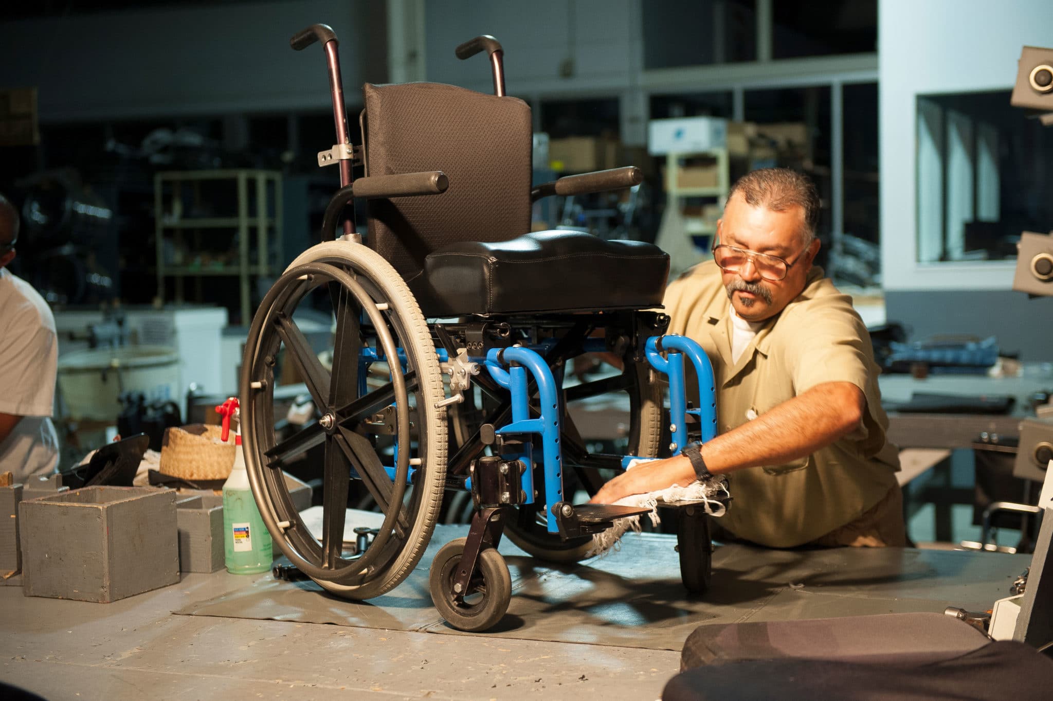 A worker restores a used wheelchair