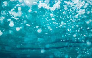 Close up from below bubbly water.
