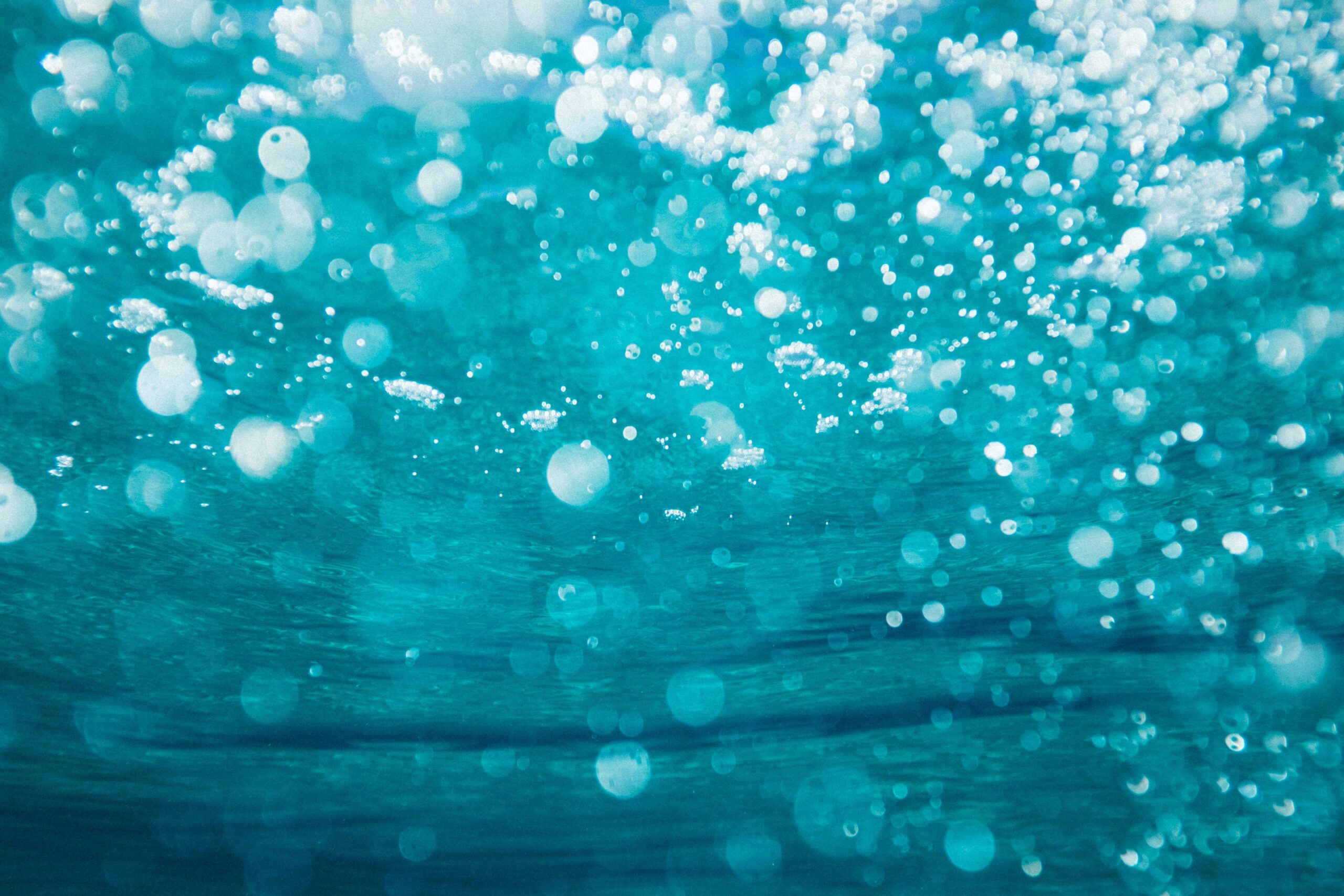 Close up from below bubbly water.