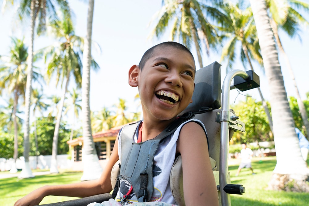 A child smiling at International Family Retreat El Salvador