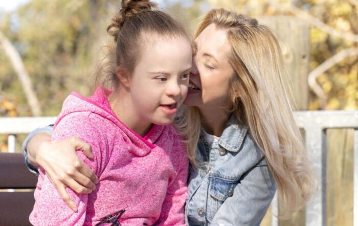 A heartwarming moment of Shauna Amick hugging her daughter, Sarah.