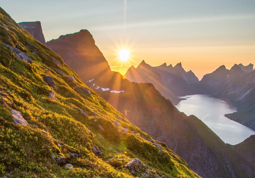 Sunlight shining brightly over mountain peaks