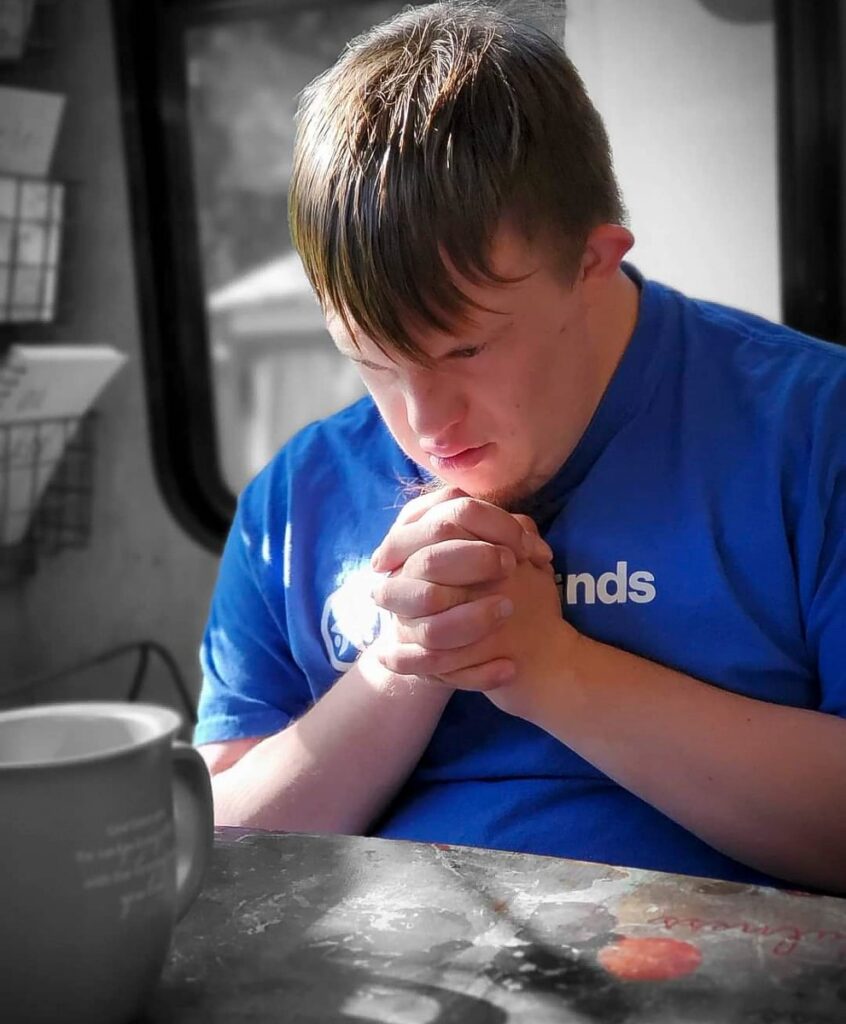 A young man prays