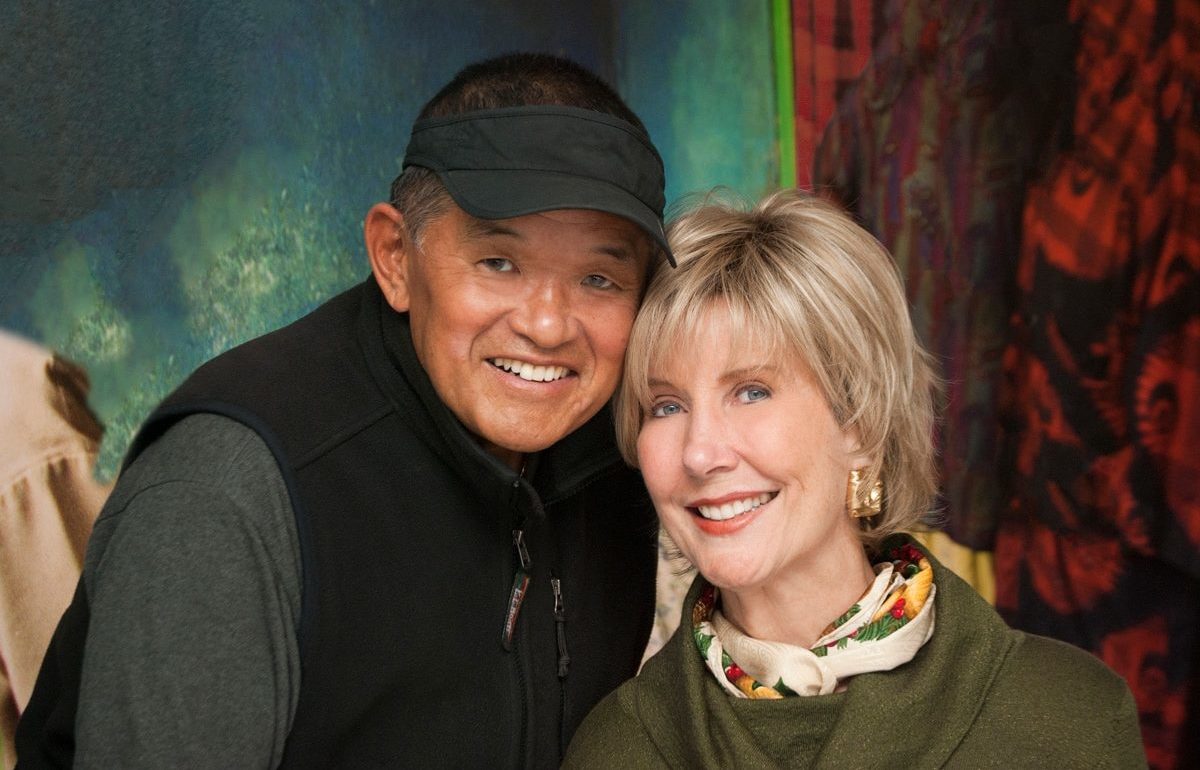 Ken and Joni next to each other. Both are smiling for the camera. 