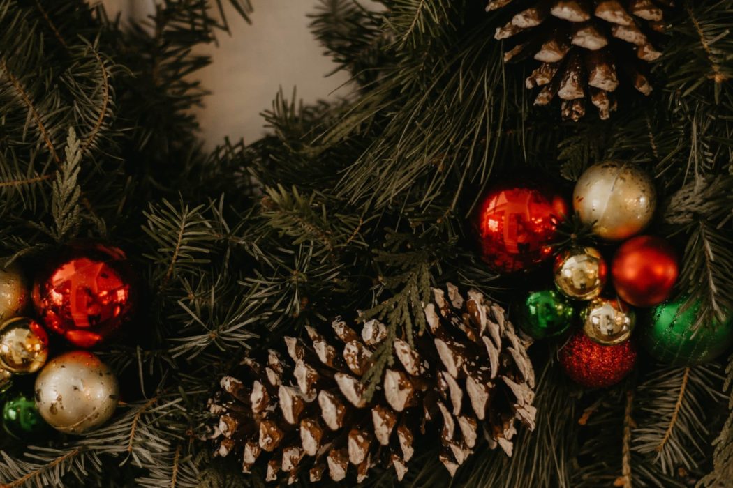 Close-up of Christmas balls, acorns, and pine branches on a Christmas tree
