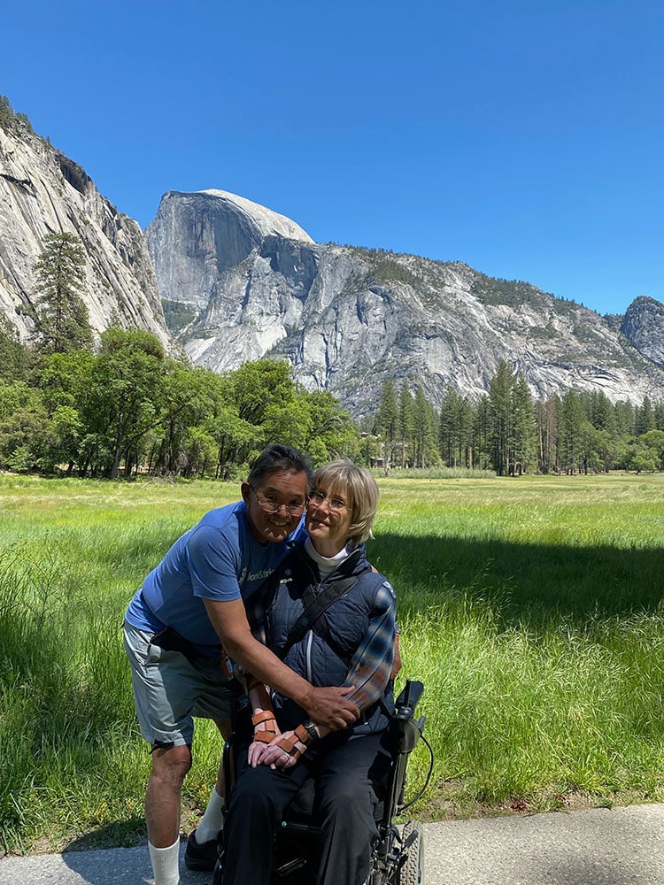 Joni and Ken take a photo with Yosemite in the background