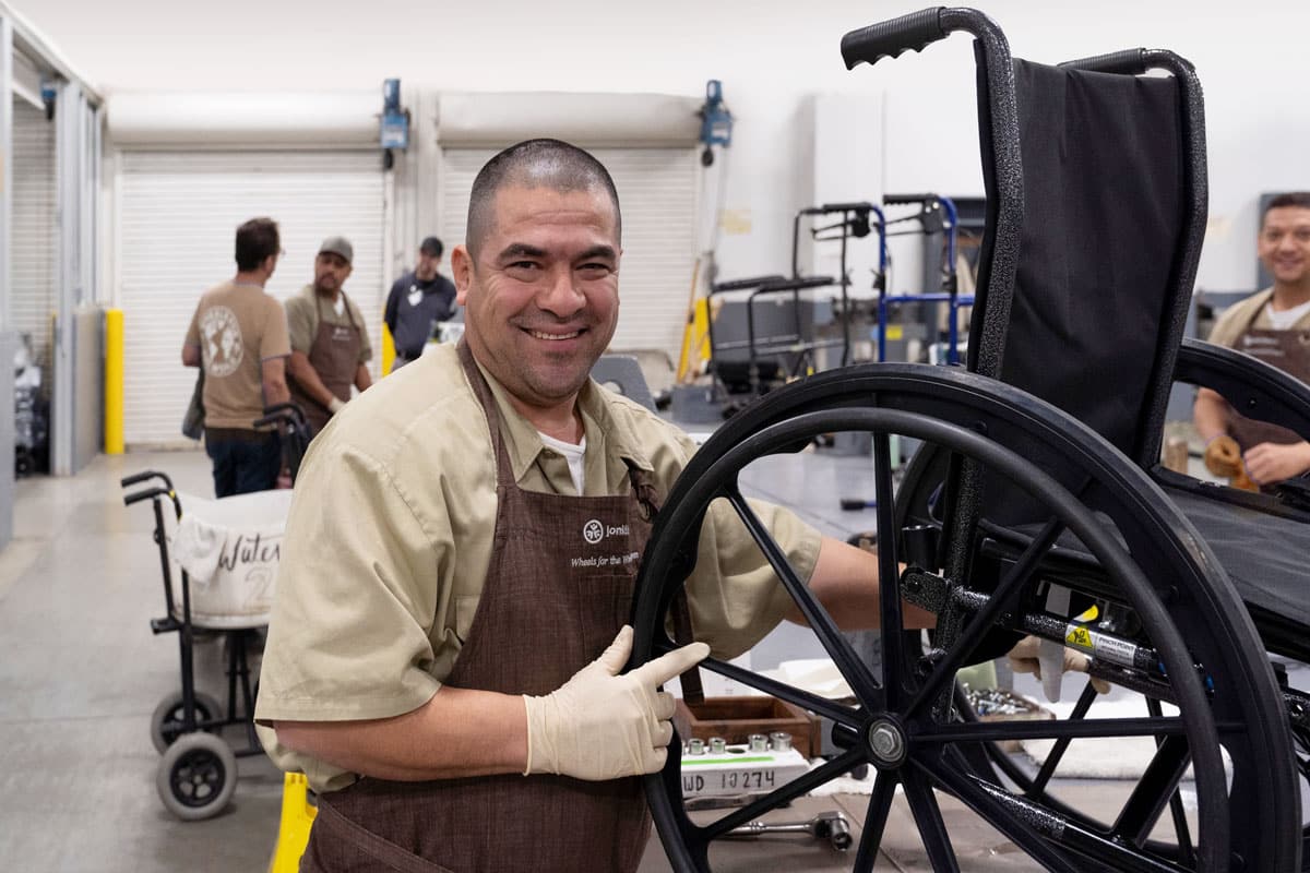 An inmate restores a wheelchair