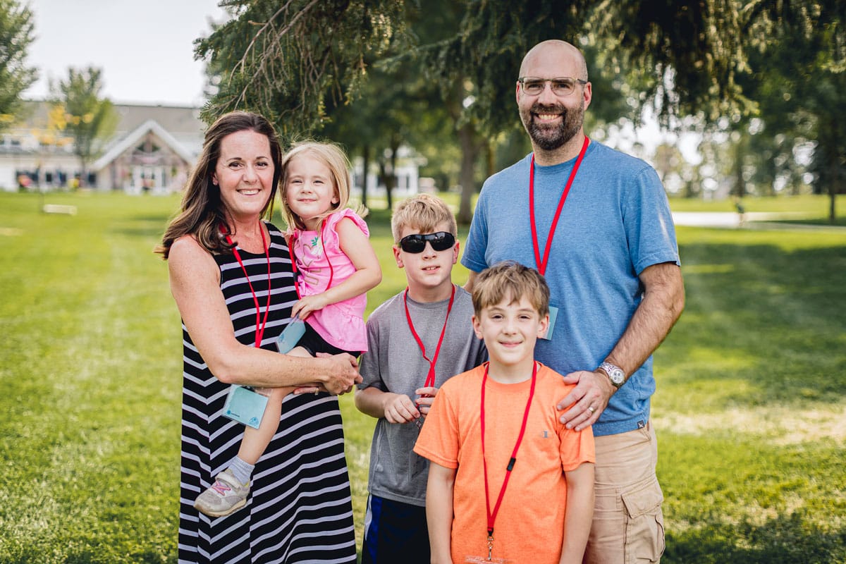 A family of five, a mother and father along with their three children.