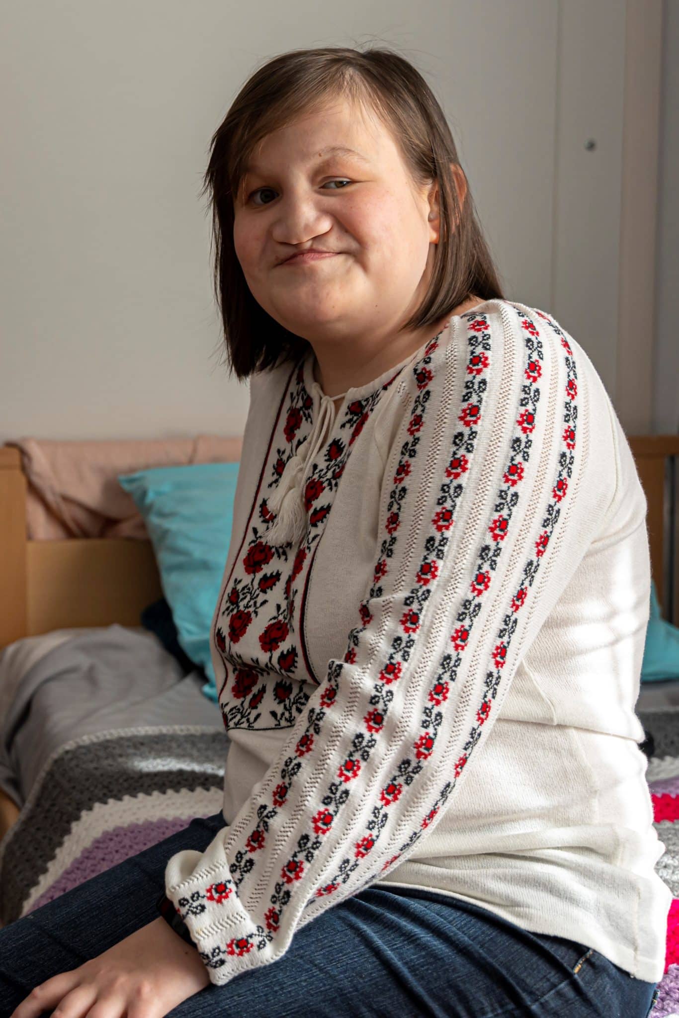 A Ukrainian girl smiles at the camera