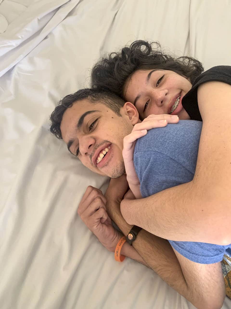 Libby and Lane smiling and hugging.