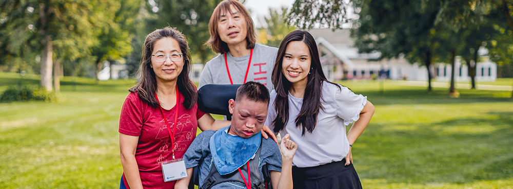 A group of people posing for a picture at Family Retreat