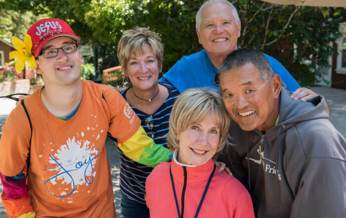 Nancy, Bart and Evan smiling at the camera with Joni and Ken.