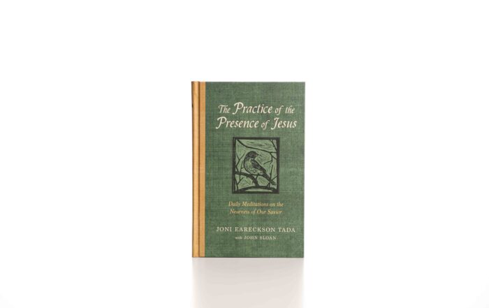 A picture of Joni's new book, "The Practice of the Presence of Jesus," sitting on a white table with a white background.