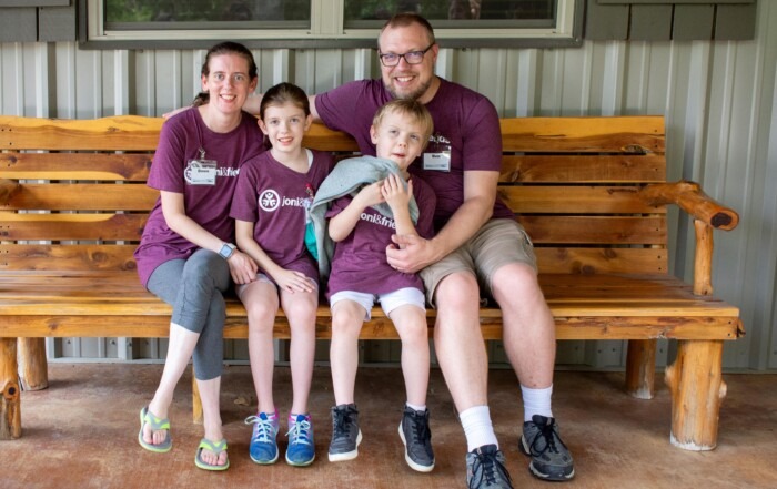 A group photo of Dawn and Ben and their kids Alexa Anne and Elijah all smiling at the camera.