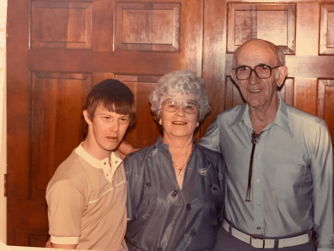 A group photo of Don and his parents, Wilbur and Opal, smiling at the camera.