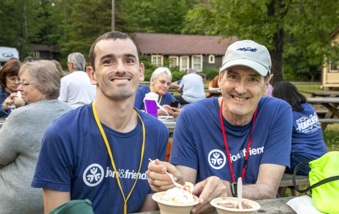 Tim (on the left) and Don (on the right) with ice cream on the table at the Family Retreat.