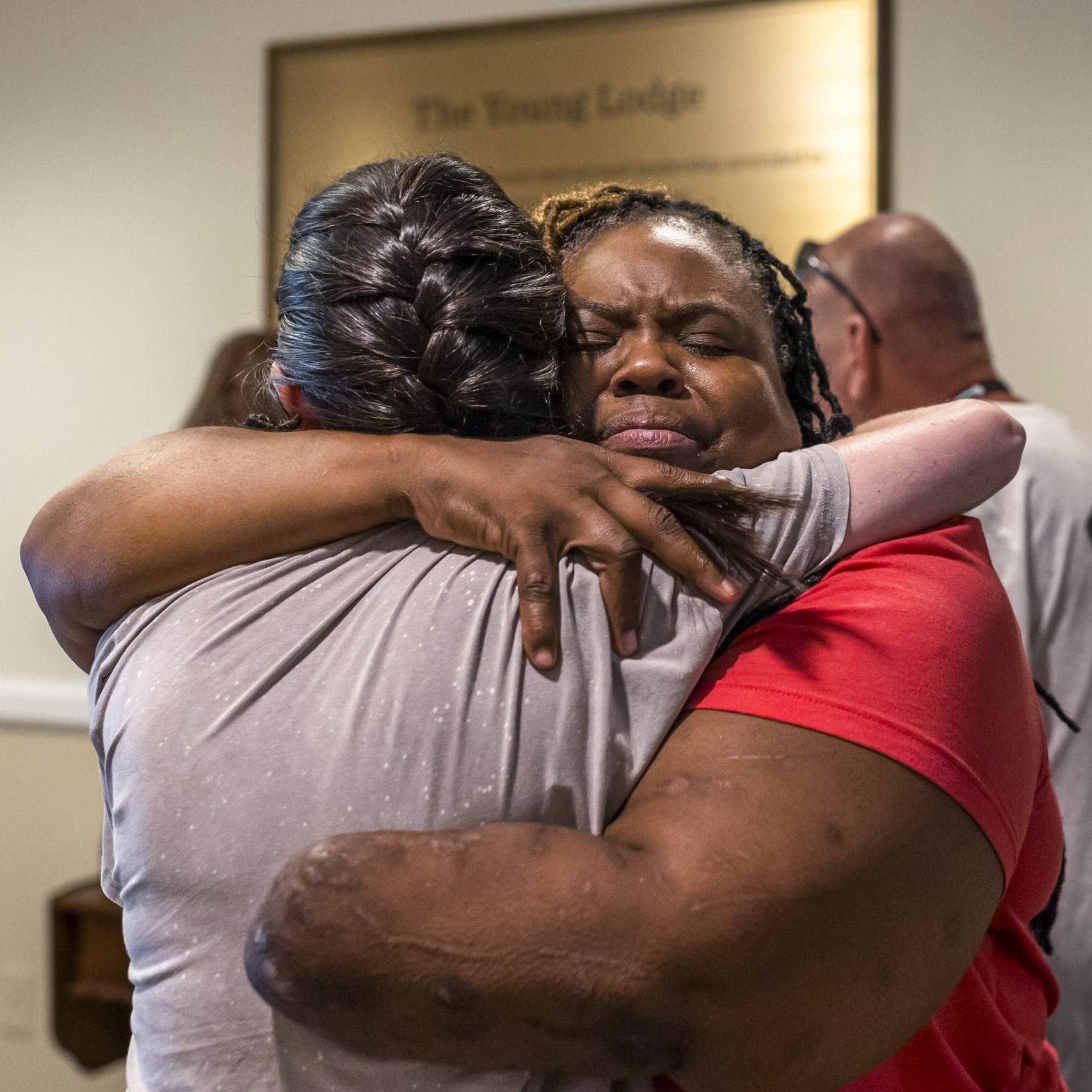 Natacha hugging a woman at Warrior Getaway.