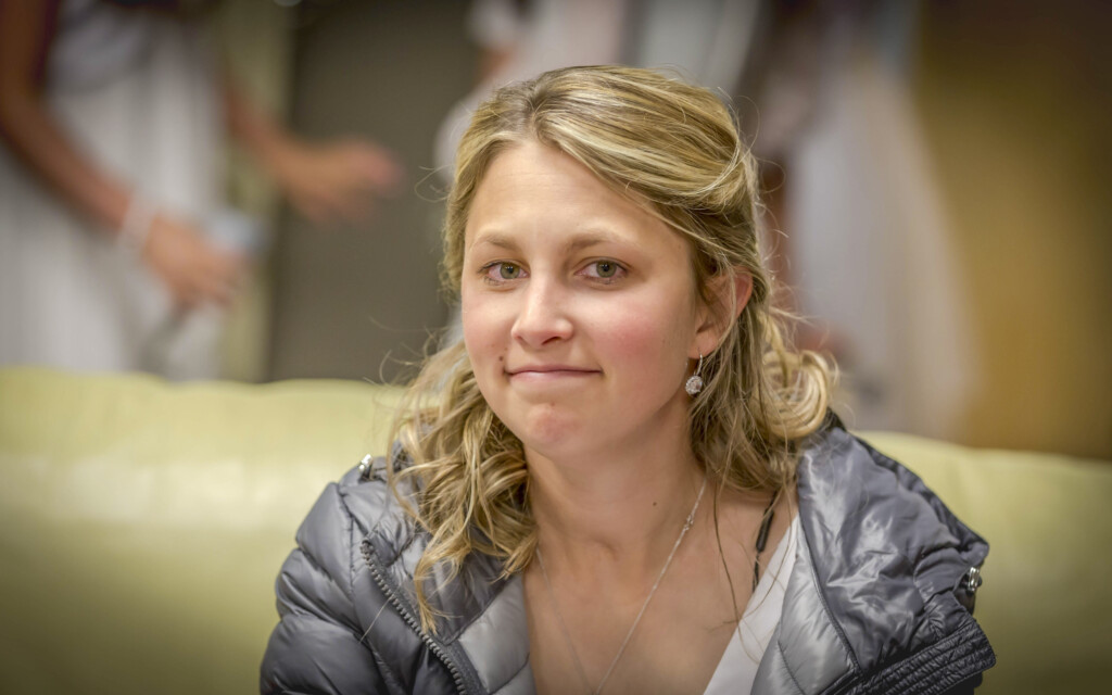 A close-up of Rachel smiling at the camera.