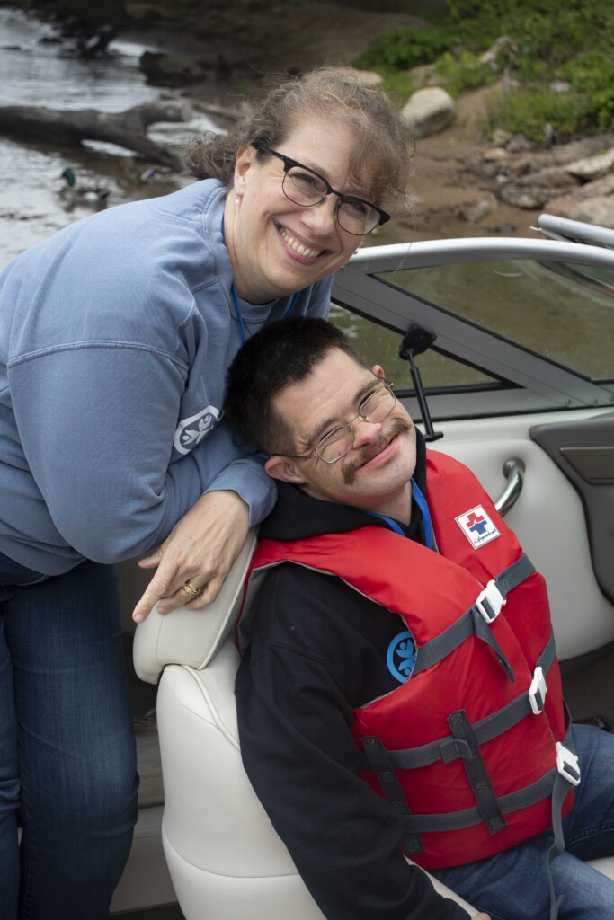 Shauna and BJ smiling for the camera while in a boat during Family Retreat.