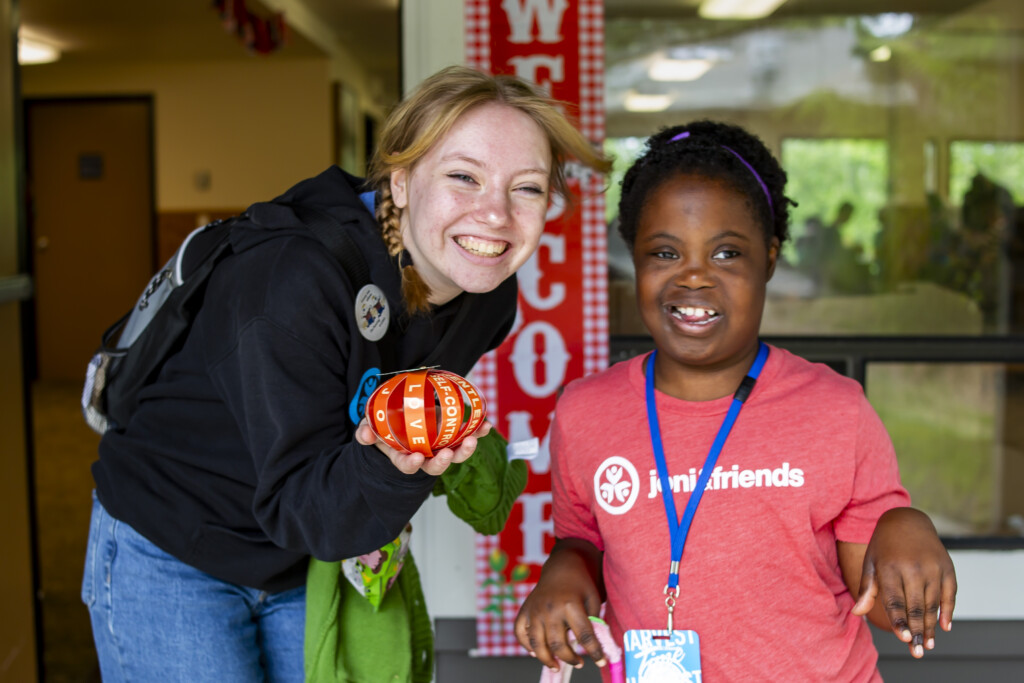 A volunteer at Joni and Friends and Lydia both having fun together at the Family Retreat. 