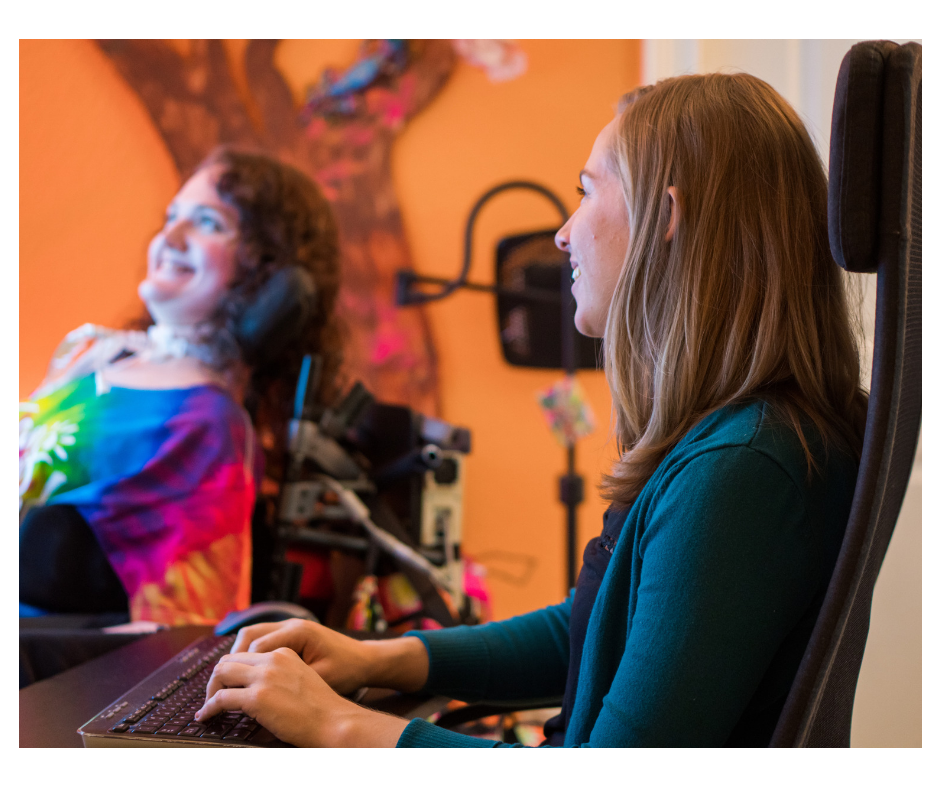 A side view of a girl typing on a keyboard in a chair, with a slightly blurred Paige Snedeker smiling in the background.