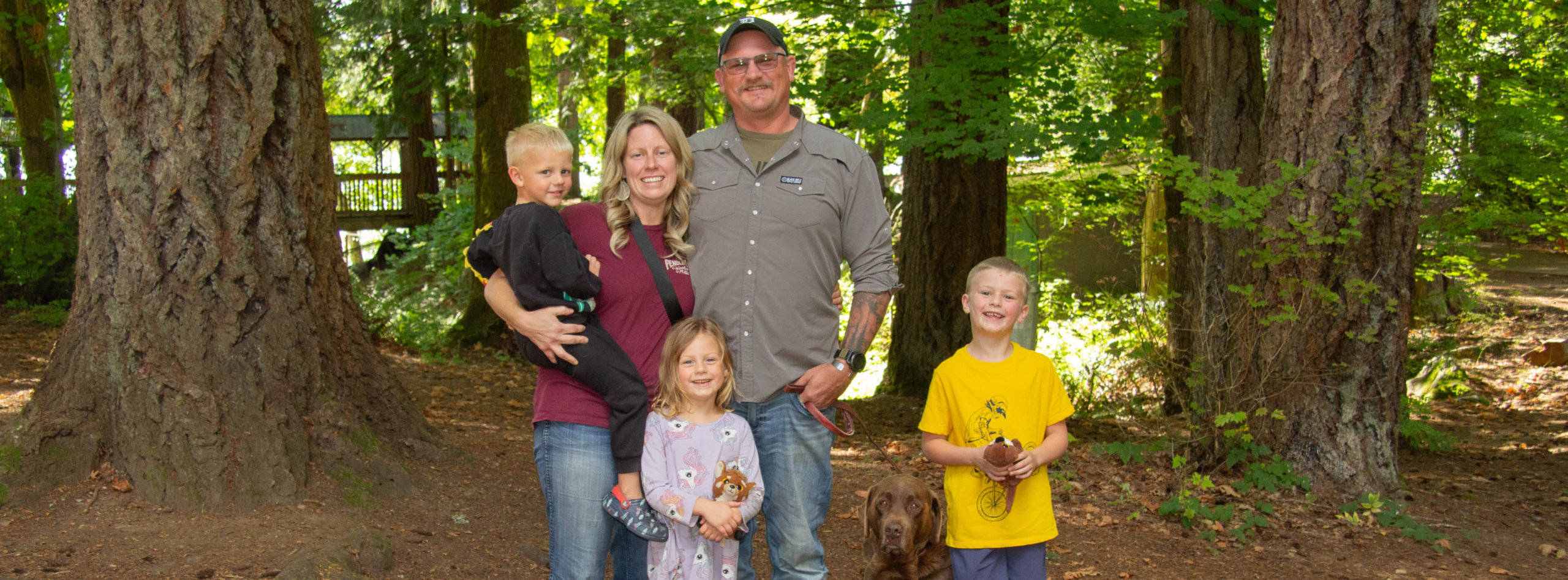 A smiling family enjoys time spent together at Warrior Getaway.