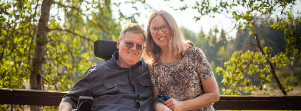 A man and woman pose for a photo at Marriage Getaway