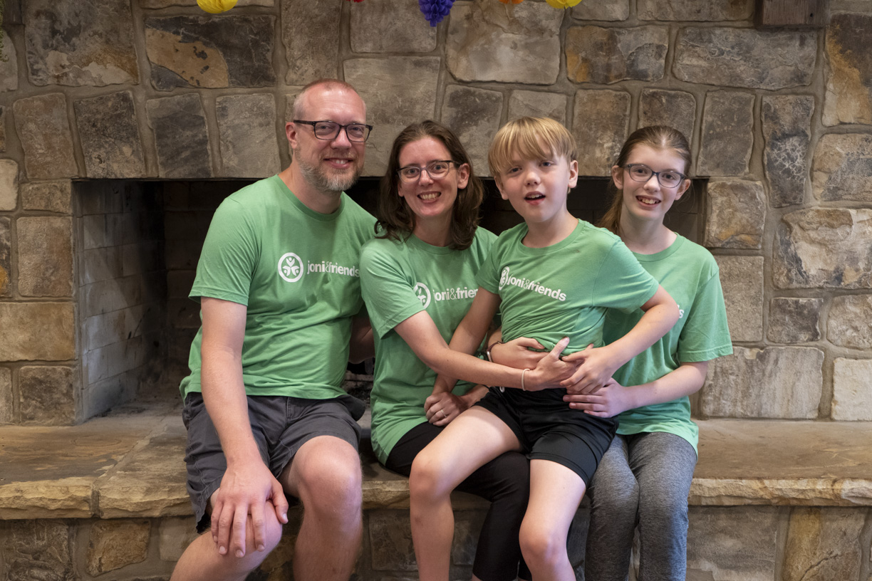 The Apperson Family – Ben, Dawn, Elijah, and Alexa Anne – sitting together and smiling for the camera.