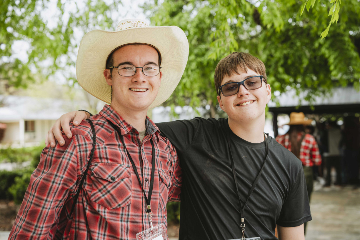 Two men smiling and posing for the camera during a Family Retreat.