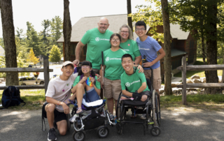 Art and Jen posing for the camera with their children—Caleb, Robert, Jacob, Zoey, and Bethany—outdoors.