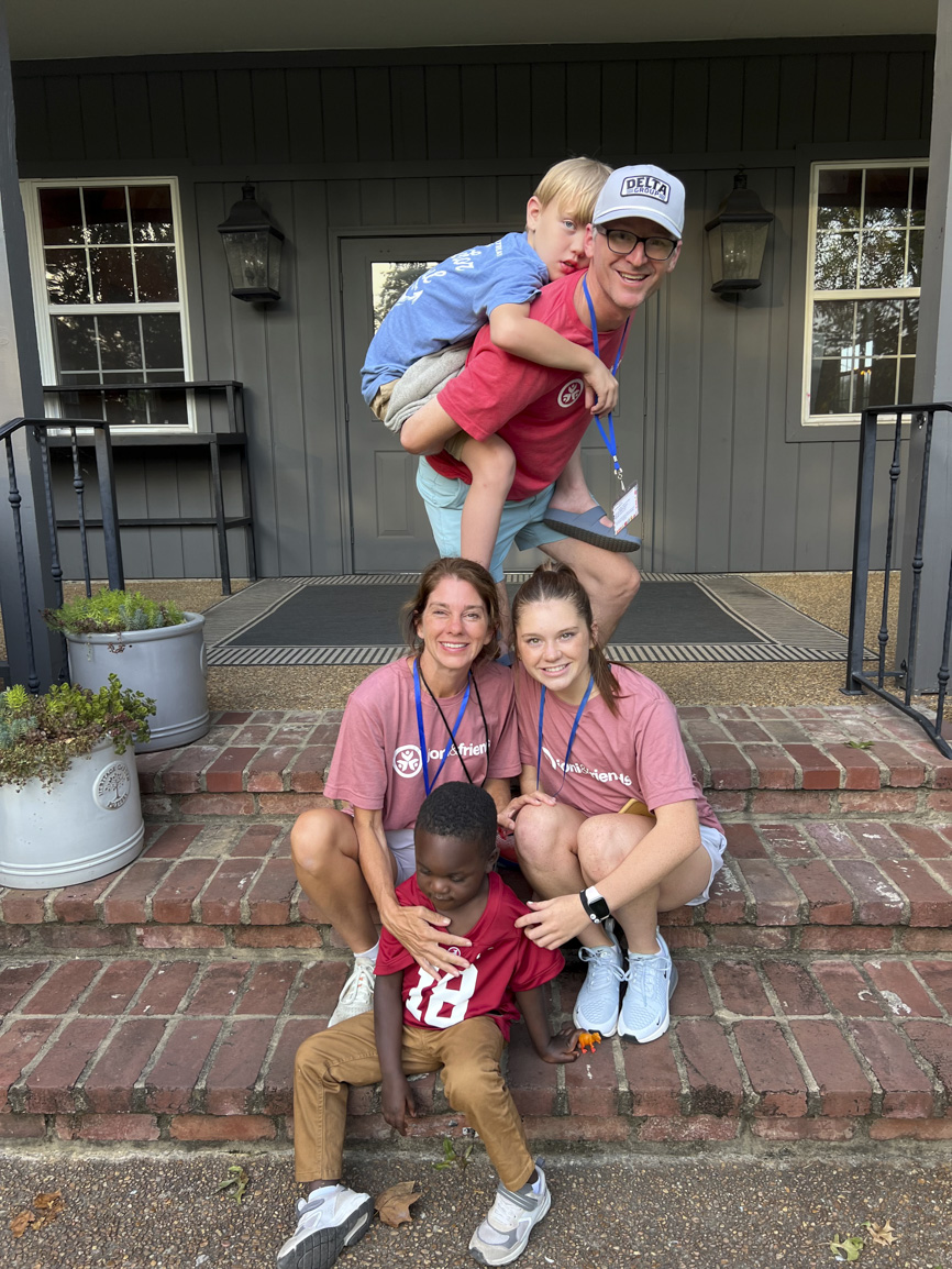 Elijah with four new buddies at Family Retreat, smiling and enjoying their time together.
