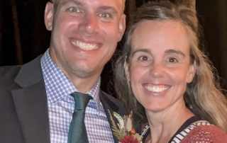 Joni Oberhauser and her husband Mark smiling at the camera.