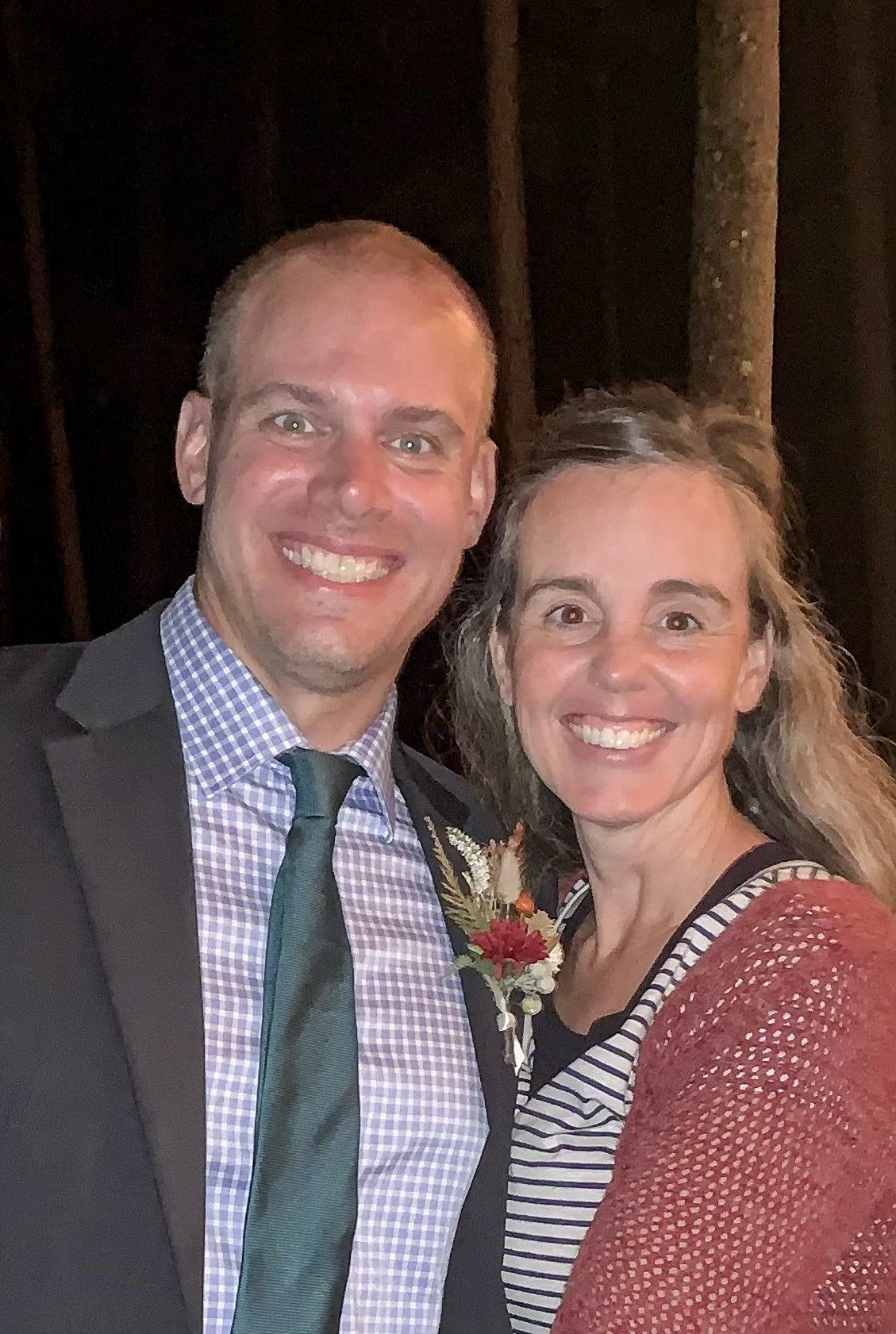 Joni Oberhauser and her husband Mark smiling at the camera.