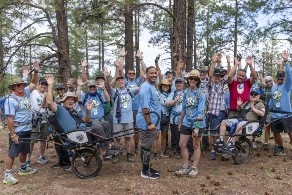 Campers and volunteers pose for a photo at Family Retreat