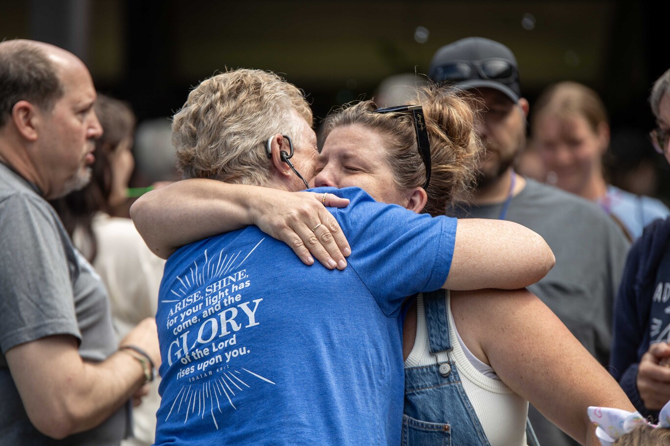 Jennifer, Tana’s mom, receives a warm hug from a woman during the Family Retreat.